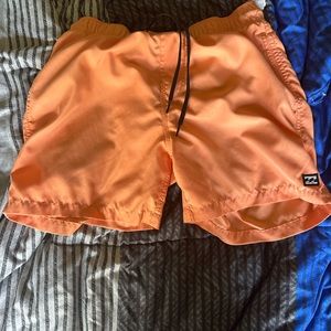 Orange shorts.